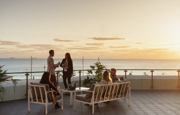 Professionals talk at a business event